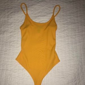 yellow bodysuit